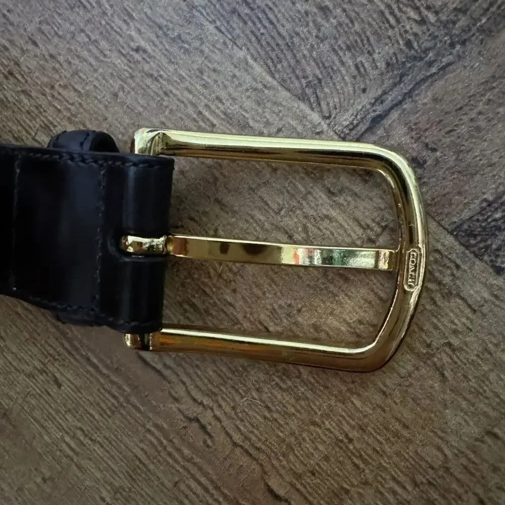 Black leather coach belt *has flaw
